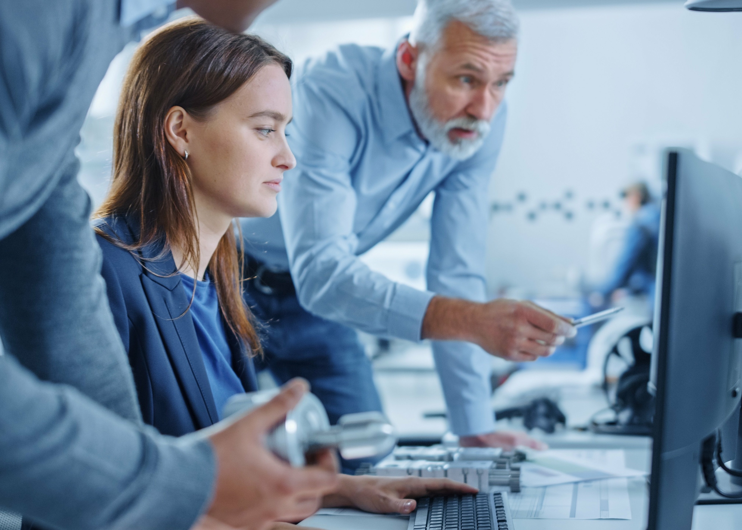 Employees discussing something on the computer